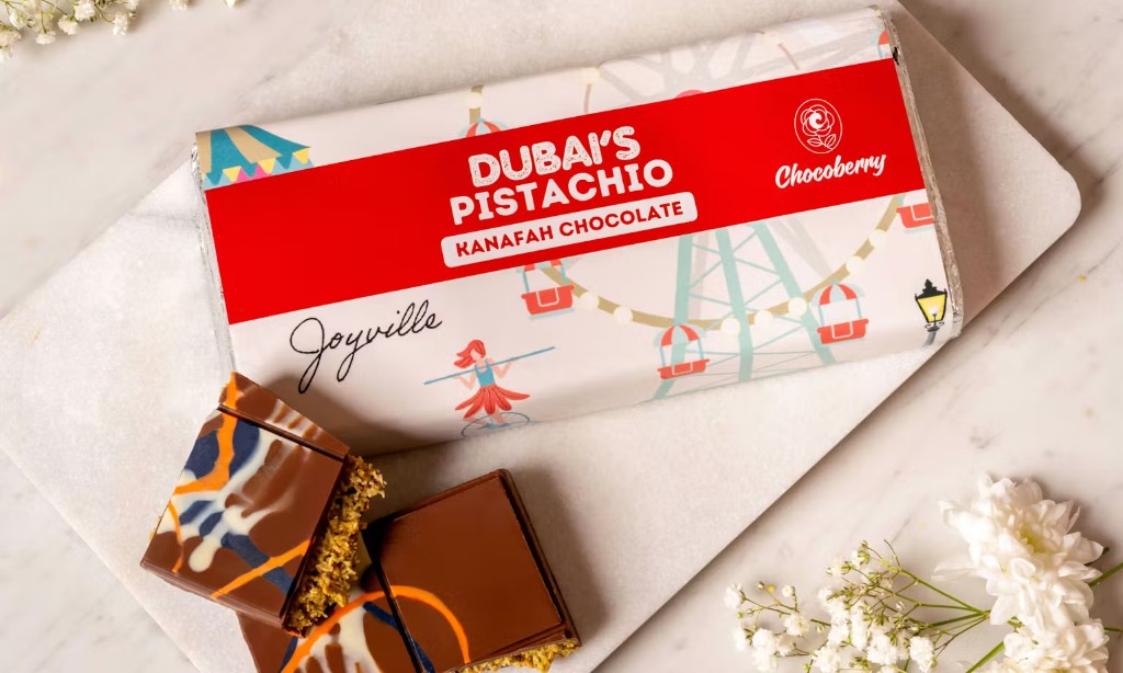 Artisan chocolate bar with illustrated wrapper and pistachio filling